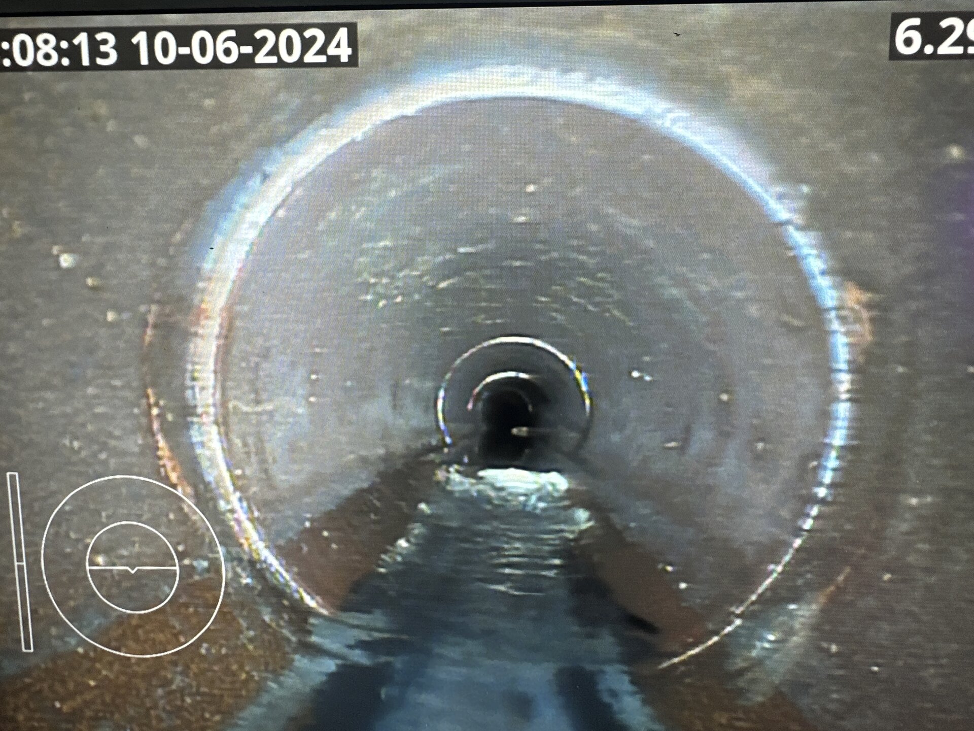CCTV camera footage inside a stormwater pipe showing internal pipe condition